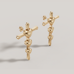 Load image into Gallery viewer, Gold abstract earrings on a light gray background