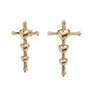 Gold cross and heart earrings on a white background